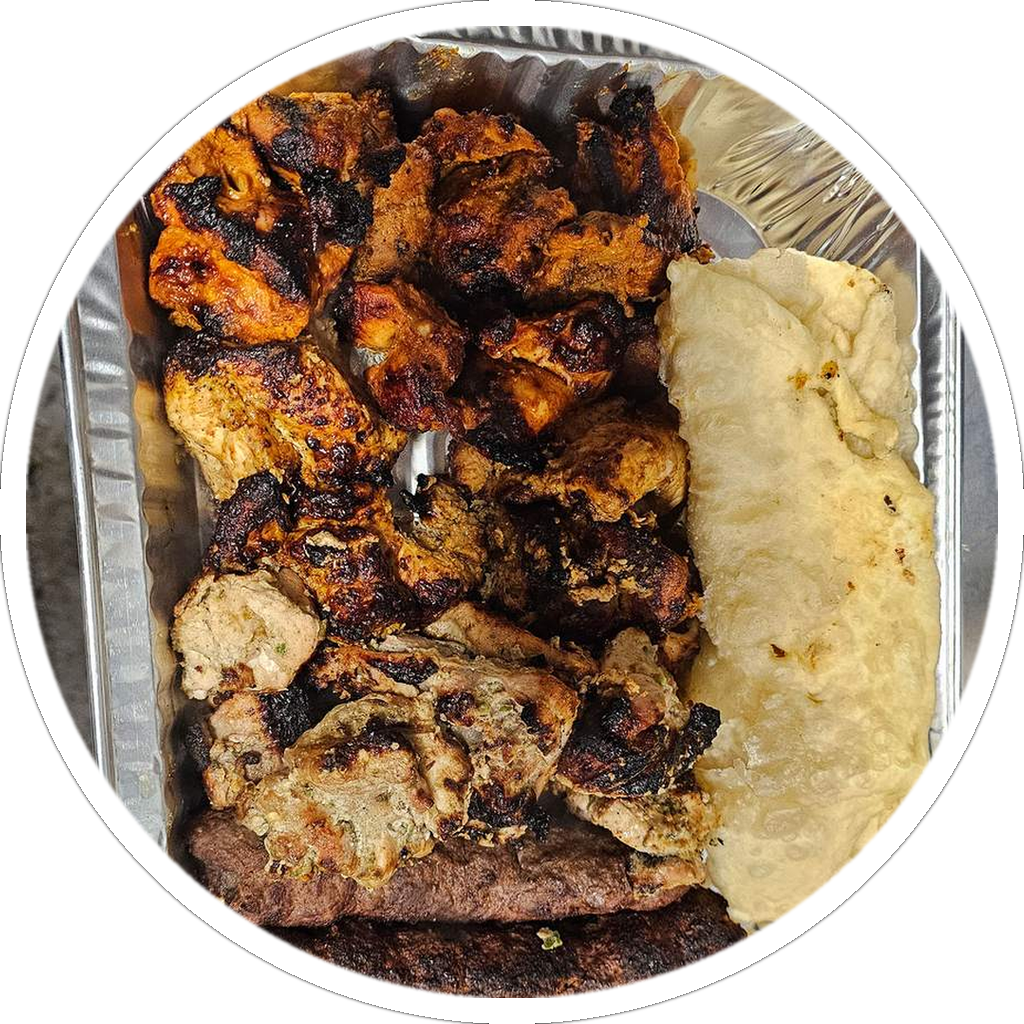 A Kababistan sharing platter of grilled chicken with fresh bread